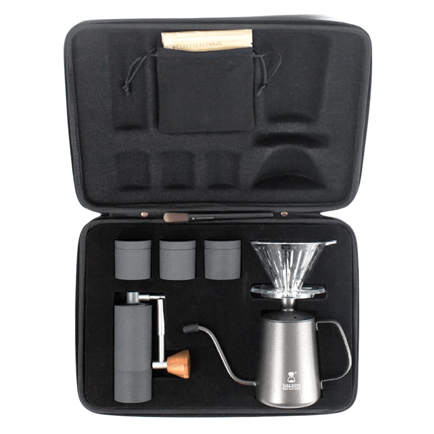 Black travel brewing kit that includes a coffee grinder and other equipment